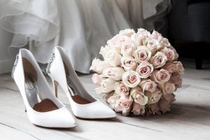 bouquet of flowers and bridal shoes